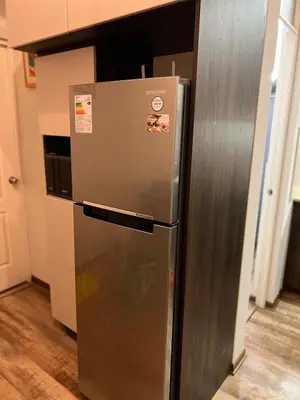 a stainless steel refrigerator in a kitchen at Private Whole Apartment in Surco close to Barranco in Lima