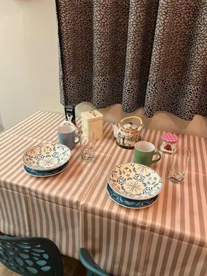 a table with plates and cups on top of it at Private Whole Apartment in Surco close to Barranco in Lima