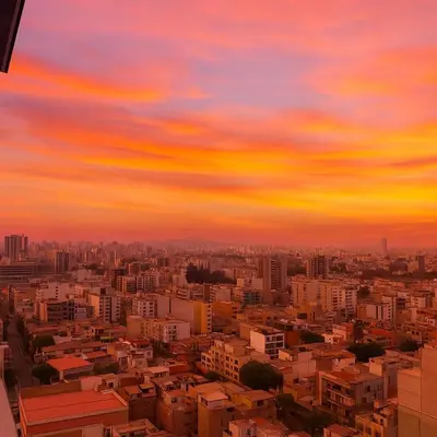 a view of a city at sunset at LimaeStays Exclusive penthouse in downtown Barranco in Lima