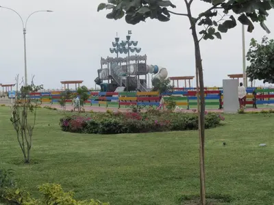 a park with a playground with a roller coaster at Panoramic View in Lima