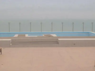 a swimming pool with a bench in a building at Panoramic View in Lima