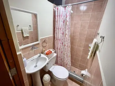 a small bathroom with a toilet and a sink at Close to the beach, Big beds, Malecon Miraflores in Lima