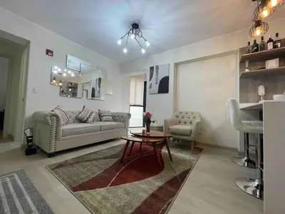 a living room with a couch and a table at Nice Department Full Equip in Barranco - Gym, Pool in Lima