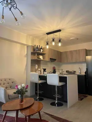 a kitchen and living room with a couch and a table at Nice Department Full Equip in Barranco - Gym, Pool in Lima