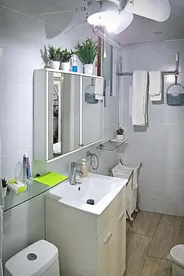 a white bathroom with a sink and a toilet at Flat between Barranco, Miraflores & Surco in Lima