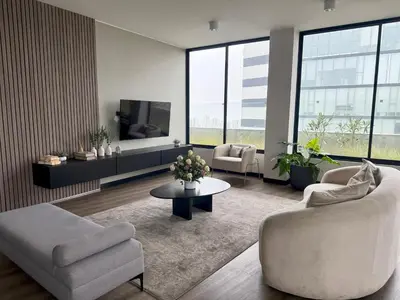 a living room with two couches and a tv at Departamento Style in Lima