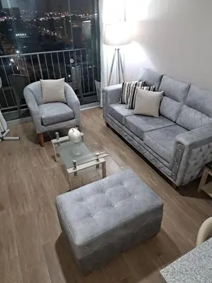 a living room with a couch and a chair at Modern apartment with great view in Lima in Lima