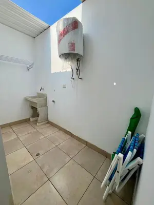 a bathroom with baseball bats on the wall at Departamento con salida a la playa Punta Rocas 202 in Punta Negra