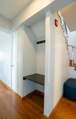 a room with a bench under the stairs at Duplex Moderno y Espacioso en Miraflores in Lima
