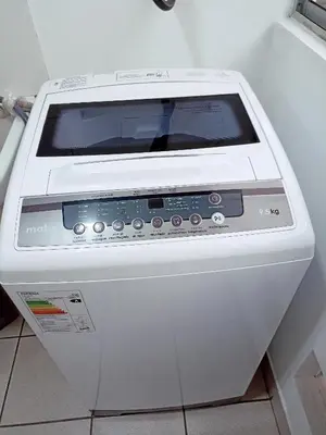 a white computer monitor sitting on top of a counter at Departamento amoblado y Estacionamiento Gratis in Lima