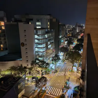 a view of a city at night with buildings at Modern Brand New Apartment in Miraflores in Lima