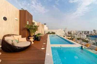 a balcony with a swimming pool on a building at Modern Brand New Apartment in Miraflores in Lima