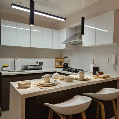 a kitchen with a counter with plates and bowls on it at Modern Brand New Apartment in Miraflores in Lima