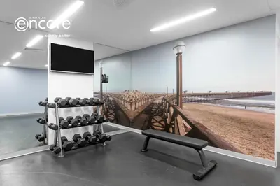 a gym with a view of a pier at Ramada Encore by Wyndham Lima San Isidro in Lima