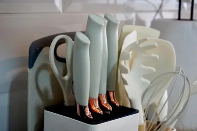 a knife block with white knives in it at Great New Studio in Barranco in Lima