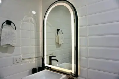 a bathroom with a sink and a mirror at Great New Studio in Barranco in Lima