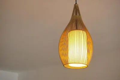 a lamp hanging from a ceiling with a light at Great New Studio in Barranco in Lima