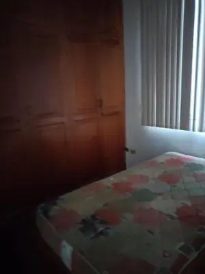 a bedroom with a bed and a window and a door at Miraflores Cozy Private Apartment with ocean view in Lima