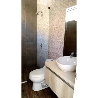 a bathroom with a toilet and a sink at Maya House Cieneguilla in Cieneguilla