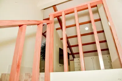 a set of wooden stairs in a room at Casa Campo-Playa Sand in My Shoes in Chincha