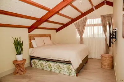 a bedroom with a bed and a window at Casa Campo-Playa Sand in My Shoes in Chincha