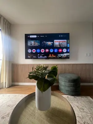 a living room with a vase with a plant on a table at Great 1BR in San Isidro in Lima
