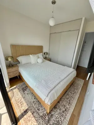 a bedroom with a large bed with a rug at Great 1BR in San Isidro in Lima