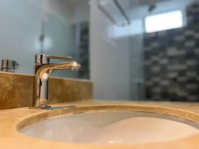 a sink with a faucet in a bathroom at Entire apartment minutes from Miraflores in Lima