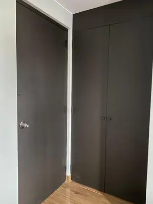 an empty room with a closet and a door at Hotel Naciones Unidas in Lima