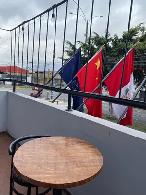a table sitting on a counter with flags in the background at Hotel Naciones Unidas in Lima
