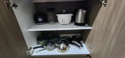 a cupboard with utensils and a coffee maker at Modern suite in San Miguel -Costa 21 in Lima