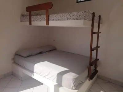 a bedroom with two bunk beds in a room at Casa de Playa en Lobos in Cerro Azul
