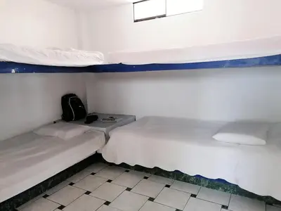 two bunk beds in a small room with at Casa de Playa en Lobos in Cerro Azul