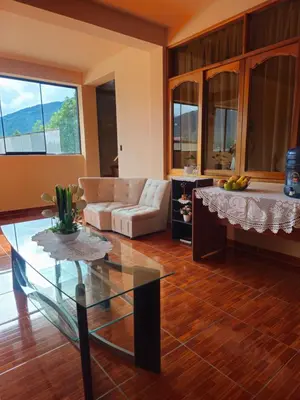 a living room with a couch and a table at Echevarria Oxapampa in Oxapampa