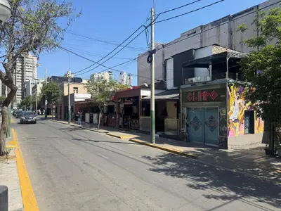 an empty street in a city with a building at Centrally located and comfortable duplex in Miraflores - Libertad1BR in Lima