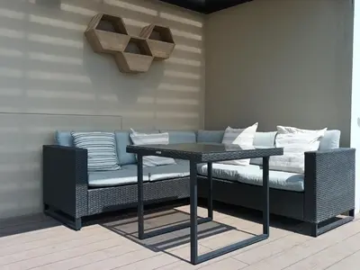 a couch and a table in a room at Katty's apartment - Santa Beatriz in Lima