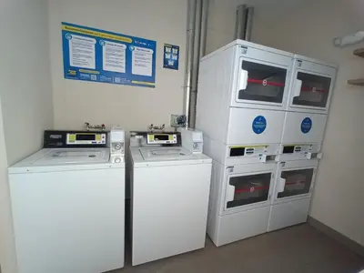 a room with two washers and two washers at Katty's apartment - Santa Beatriz in Lima