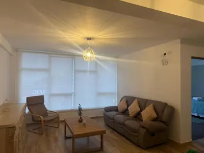 a living room with a couch and a table at Welcoming apartment in Lima