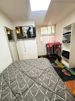 a room with a bed and a table in it at Miraflores, baño privado, ingreso independiente in Lima