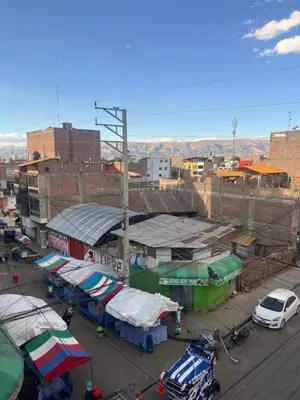 a city with buildings and cars parked on a street at HOSTElANDES in San Antonio