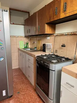 a kitchen with a stove and a sink at Miraflores, habitación en apartamento compartido in Lima