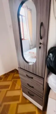 a door with a mirror on a dresser in a room at Tampumachay in Cusco
