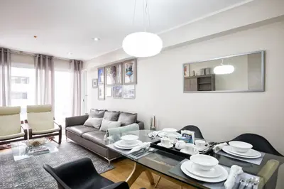 a living room with a couch and a table at Upper Pardo Apartments in Lima