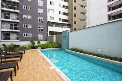 a swimming pool in the middle of a building at Upper Pardo Apartments in Lima