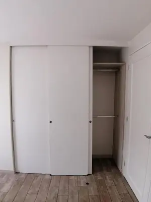 an empty closet with white walls and wooden floors at 2-Bedroom Apartment in Magdalena del Mar in Lima
