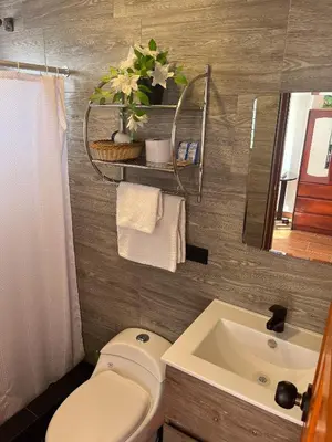 a bathroom with a toilet and a sink at Cusco and Rock in Cusco