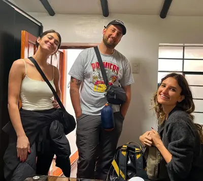 a group of three people standing in a room at Cusco and Rock in Cusco