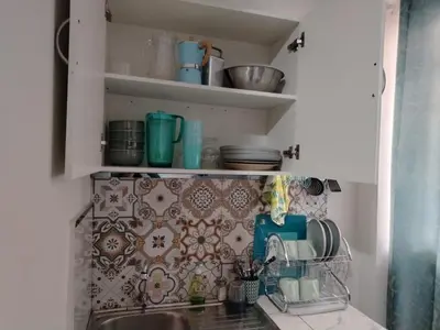 a kitchen counter with a sink and some dishes at loft Inti in Cusco