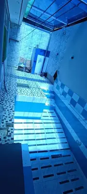 a view of a bathroom with blue lights on the floor at Casa San Ramón in San Ramón