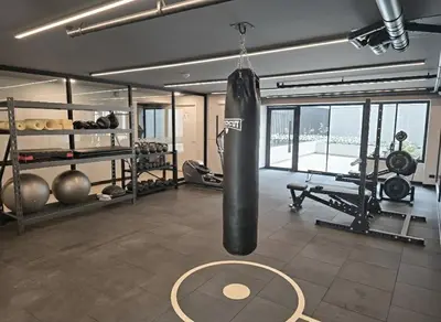 a gym with a punching bag hanging from the ceiling at Apartment suite in the heart of Miraflores! in Lima